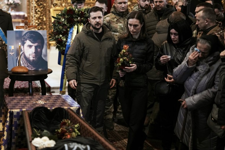 Ukrainian President Volodymyr Zelenskyy and Finnish Prime Minister Sanna Marin attend the funeral of Ukrainian officer Dmytro Kotsiubaylo, code-name 