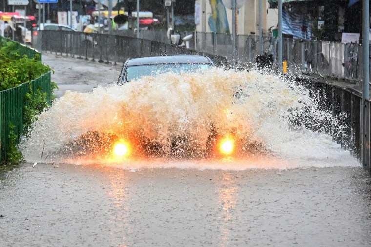 Record rainfall in Hong Kong caused widespread flooding in the early hours on September 8, disrupting road and rail traffic just days after the city dodged major damage from a super typhoon. 