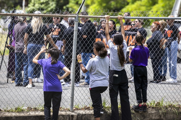 Image: Students watch their teachers protest that their school is too hot at the Escuela Elemental Santiago Iglesias Pantín school in San Juan, Puerto Rico on Sept. 7, 2023.