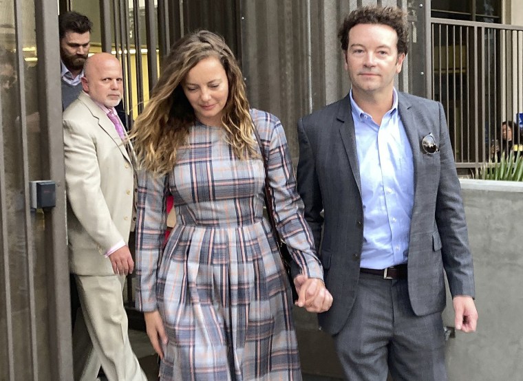 Actor Danny Masterson leaves Los Angeles Superior Court with his wife, Bijou Phillips, on November 30, 2022.  