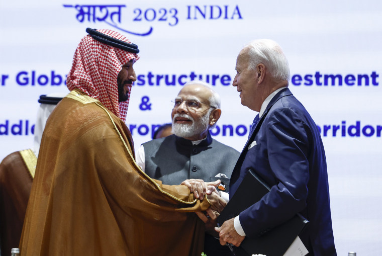 Saudi Arabian Crown Prince Mohammed bin Salman Al Saud, left, and President Joe Biden, right, shake hands next to Indian Prime Minister Narendra Modi in New Delhi on Sept. 9, 2023. 