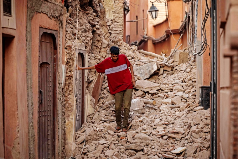 A resident navigates through the rubble on Sept. 9, 2023, following an earthquake in Marrakech, Morocco. 