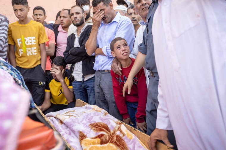 People mourn for earthquake victims in Moulay Brahim, Morocco, on Sept. 9, 2023. 