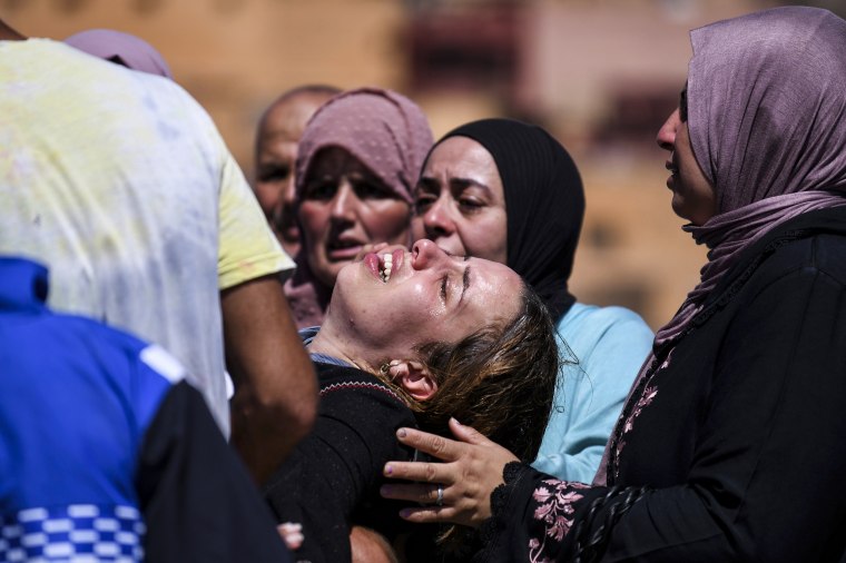 Women cry as they mourn victims of the earthquake in Moulay Brahim in the province of Al Haouz, Morocco, on Sept. 10, 2023.