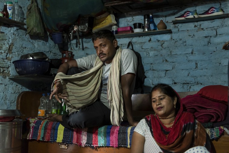 Raj Kumari, 30, and husband Santosh rest at their home in New Delhi, India, on Sept. 5, 2023.