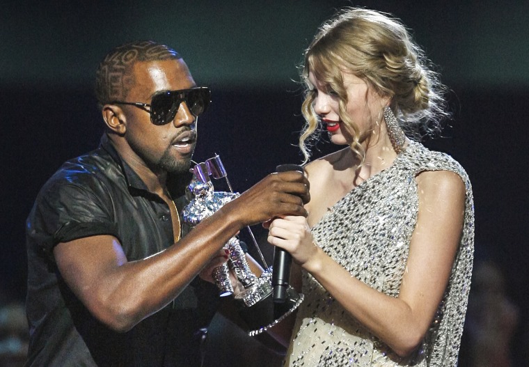 Image: Kanye West takes the microphone from singer Taylor Swift as she accepts the 