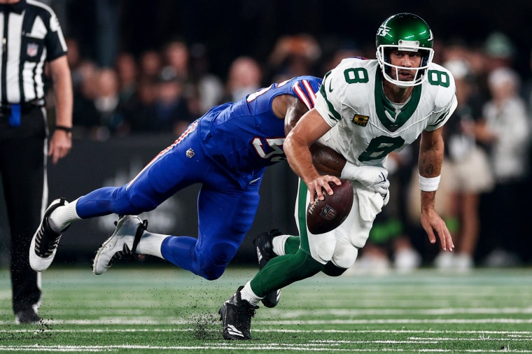 New York Jets quarterback Aaron Rodgers is sacked by Buffalo Bills defensive end Leonard Floyd in East Rutherford, N.J., on Sept. 11, 2023.