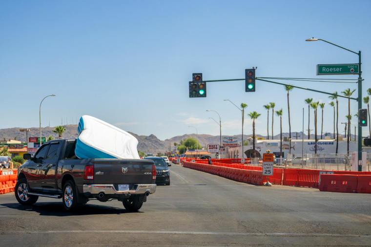 Image: A pickup truck with an inflatable pool in Phoenix on July 15.