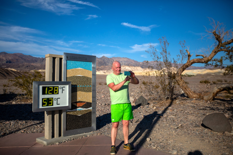 Image: A visitor takes a selfie next to the National Park Furnace Creek outdoor thermometer in Death Valley, Calif., on July 16.