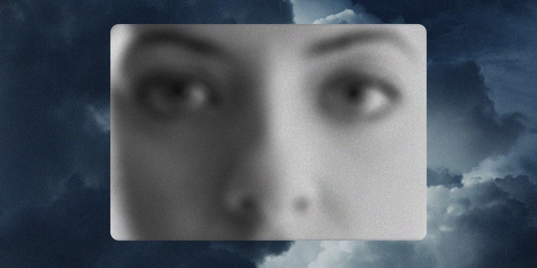 Photo illustration of a woman's wide open eyes against a background of storm clouds.