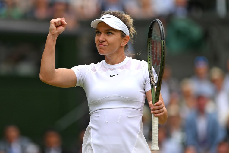 Simona Halep of Romania celebrates winning a point at Wimbledon in 2022.