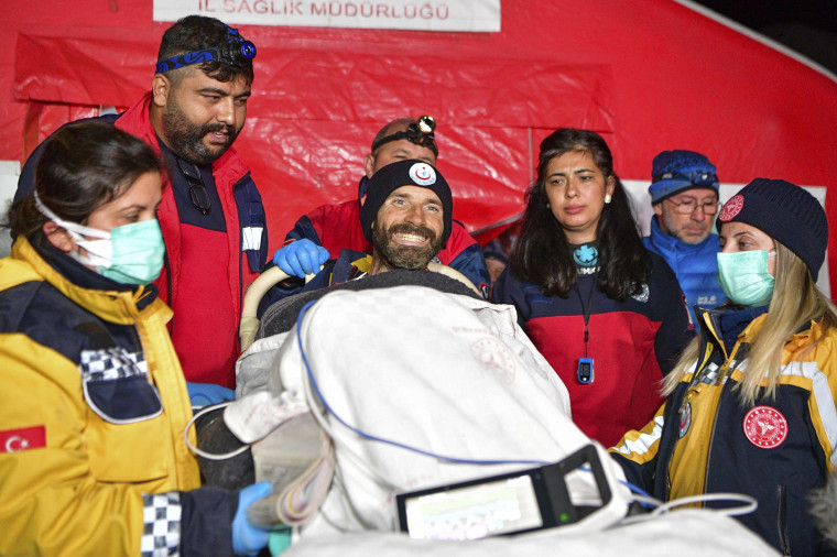 Mark Dickey, center, talks to journalists after being pulled out of Morca cave near Anamur, Turkey