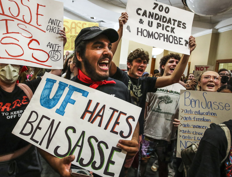 Aron AliMcClory, a second year UF student, works to lead a chant as students protest outside the President's Ballroom at Emerson Alumni Hall at the University of Florida as Sen. Ben Sasse, R- Neb., was scheduled to speak, on Oct. 10, 2022.