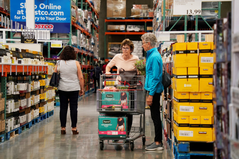 Customers shop at a supermarket