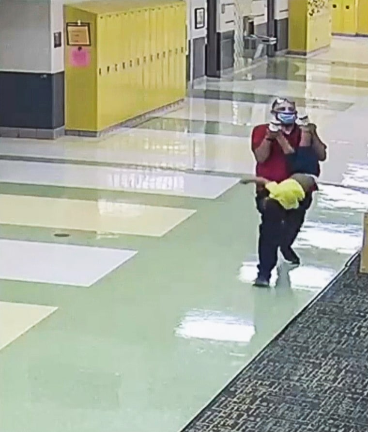 Braylen being held by his ankles at Rosa Parks Early Learning Center in Dayton, Ohio.