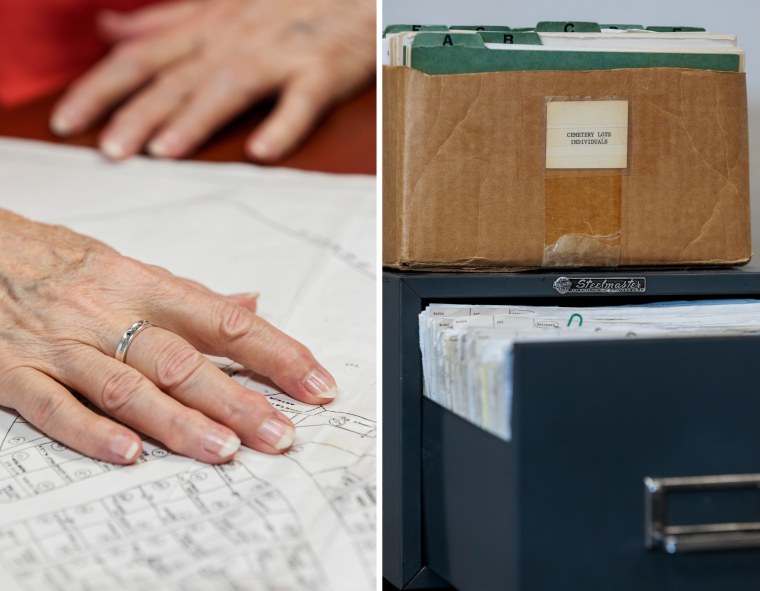 Image: Jeri Kozobarich touches a map of the cemetery plots where her baby is buried at Jacksonville City Hall in North Carolina on July 18.