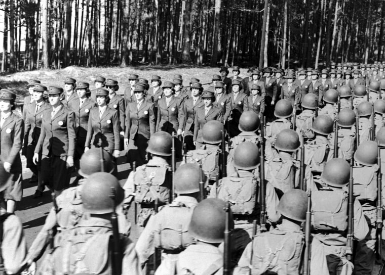 Image: Women marines, in non-combatant jobs, march into Camp LeJeune to take over for the Marines leaving to fight World War II in the 1940's.