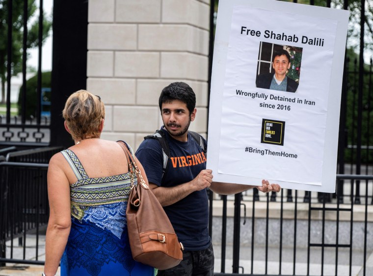 Darian Dalili protests outside the White House on Aug, 14, 2023, as he calls for the release of his father, Shahab Dalili.