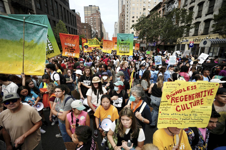 Climate activists march in the streets of New York during a protest