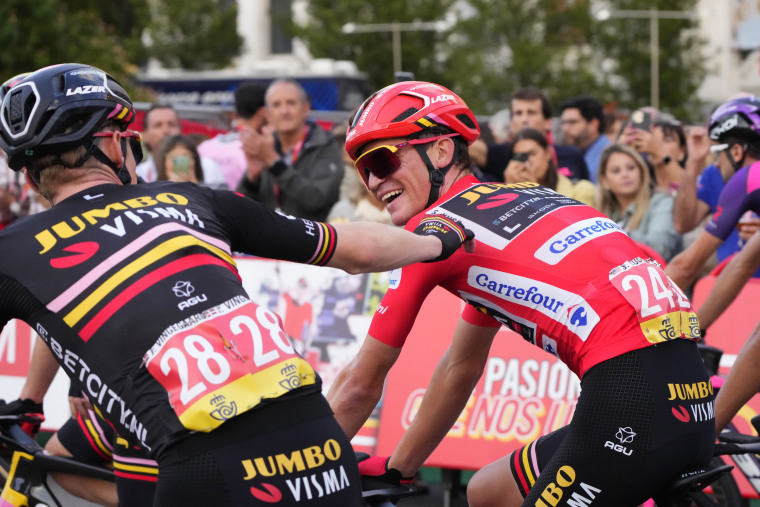 Sepp Kuss of Jumbo-Visma, right, celebrates his victory in the Vuelta cycling race in Madrid, Spain, Sunday, September 17, 2023.