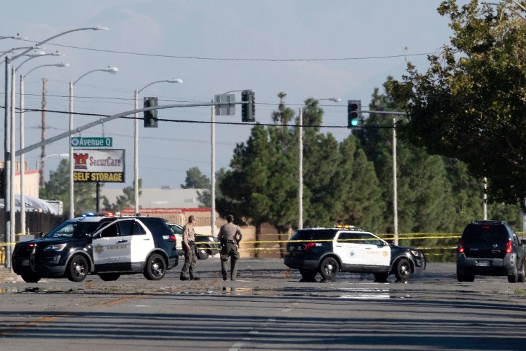 Police cars block a street where a sheriff's deputy was shot while in his patrol car in Palmdale, California on September 17, 2023. 