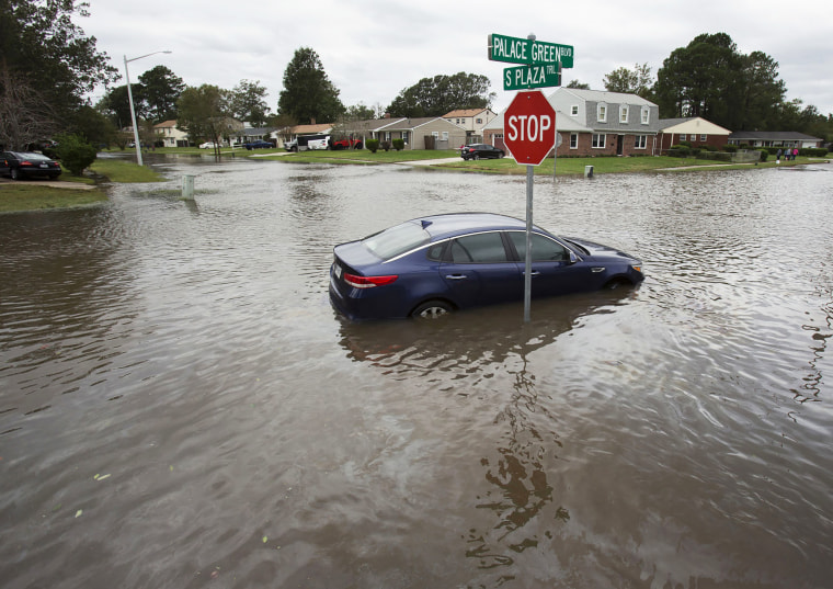 A car is stranded in Virginia Beach intersection after Hurricane Matthew 