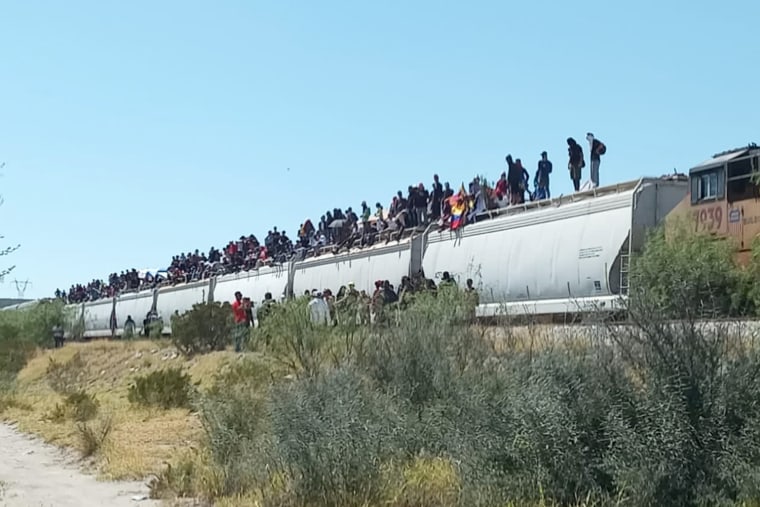 Migrants on a Viromex train in Mexico.