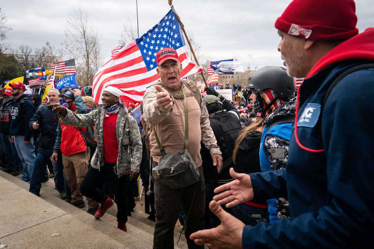 Ray Epps, in the red Trump hat, center, at the Capitol on Jan. 6, 2021.