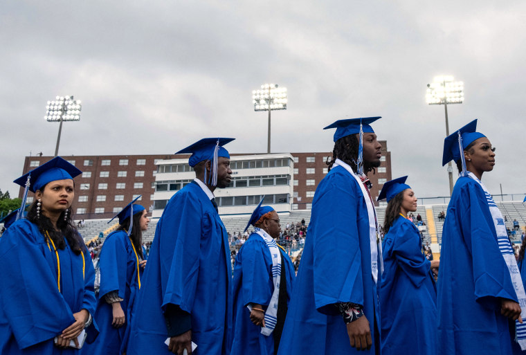 Students of Tennessee State University walk to their seats during a graduation ceremony