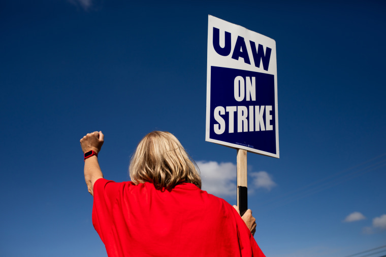 A United Auto Workers (UAW) member on a picket line outside the Ford Motor Co. Michigan Assembly plant in Wayne, Mich., on Sept. 15, 2023.