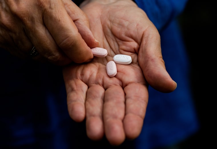 Mary Ann Neilsen holds her last Paxlovid pills while recovering from Covid-19 in Santa Barbara, Calif.