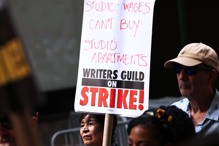 Striking WGA members picket in New York