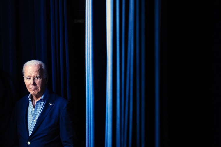 President Joe Biden waits to walk on stage during a virtual event with the National Education Association at the White House