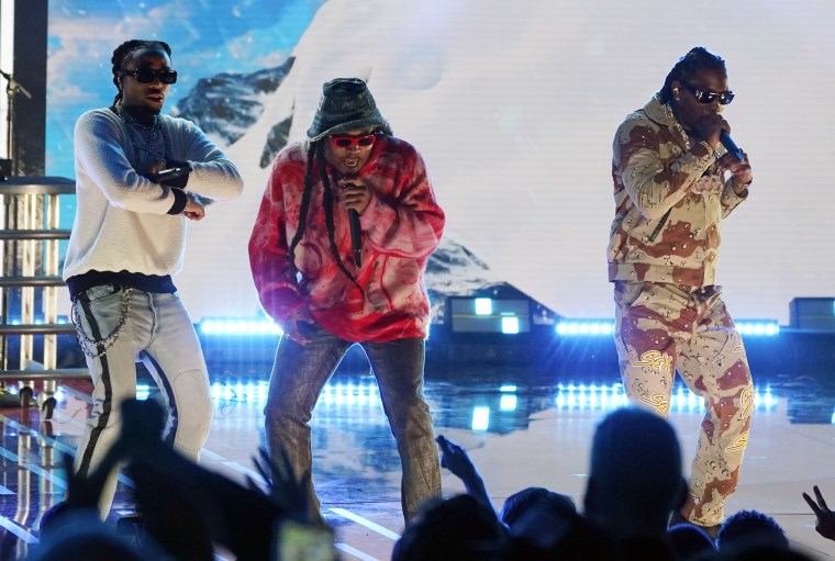 From left, Quavo, Takeoff and Offset of Migos perform at Global Citizen Live in 2021.