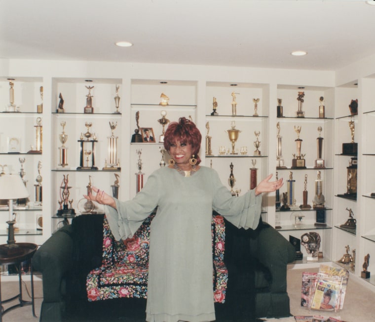 Celia Cruz in the library at her home.