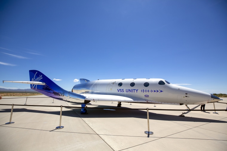 Virgin Galactic's rocket-powered plane Unity is displayed in the tarmac after a short flight to the edge of space at Spaceport America, near Truth or Consequences, N.M., Thursday, Aug. 10, 2023. Virgin Galactic is taking its first space tourists on a long-delayed rocket ship ride. (AP Photo/Andrés Leighton)