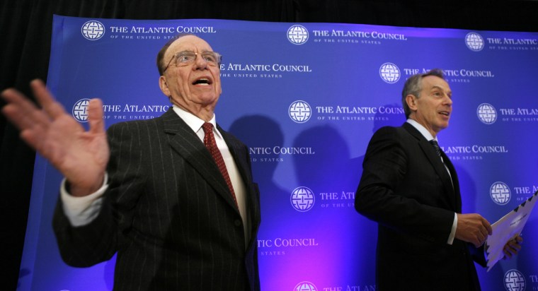 News Corp Chairman and CEO Murdoch and former British Prime Minister Blair depart a news conference in Washington