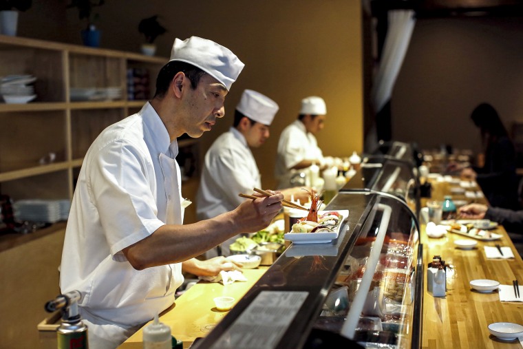 Dine Out: Benkay sushi chef Hiro Ishii puts the final touches on Omakase in Portland, Maine in 2018.