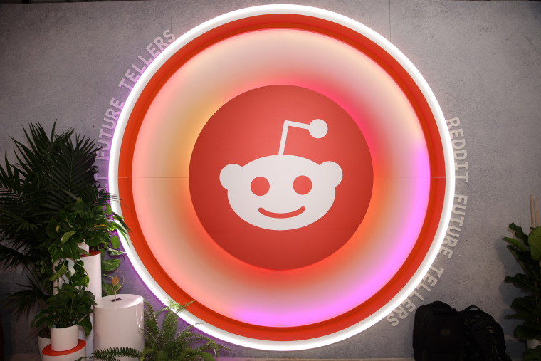 Reddit logo is displayed during an event in Las Vegas
