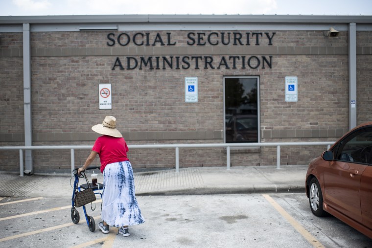 A woman walks to a Social Security office in Houston on July 13, 2022.