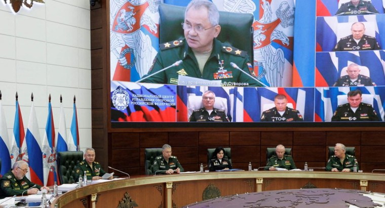 Russian Defence Minister Sergei Shoigu chairs a meeting with the leadership of the Armed Forces, as Russian fleet commanders are seen on a screen via video link, in Moscow, Russia
