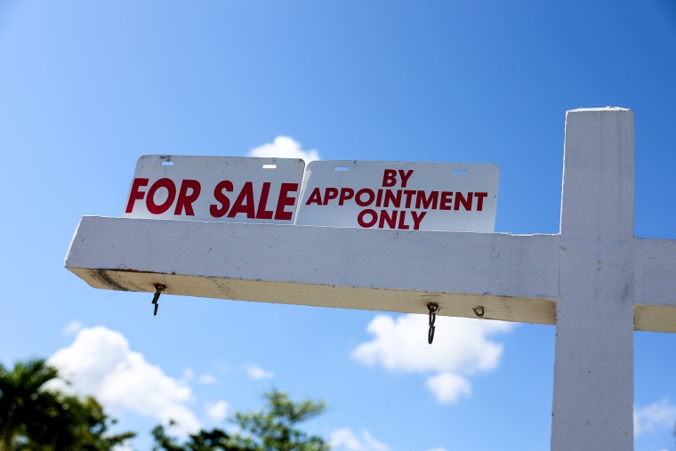 A "for sale" sign on a home in Miami on Feb. 22, 2023.