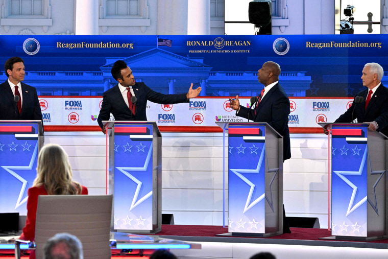IMage: Vivek Ramaswamy and Sen. Tim Scott, R-S.C., spar on the debate stage in Simi Valley, Calif., on Wednesday night.