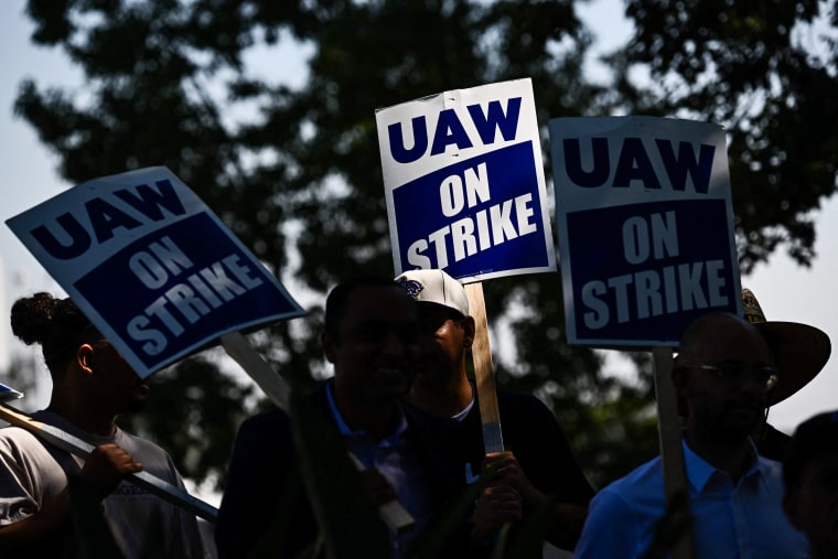 UAW members walk the picket line in front of the Chrysler Corporate Parts Division in Ontario, Calif., on Sept. 26, 2023.