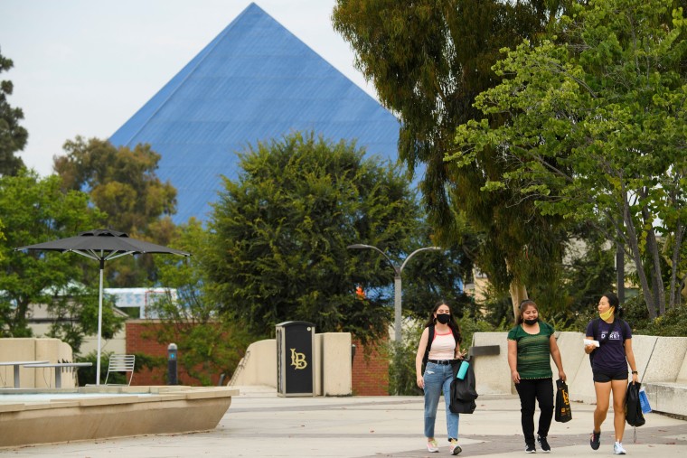 People walk on the California State University Long Beach  campus in 2021.