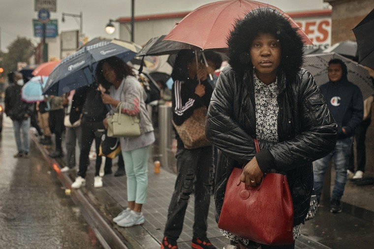 People wait for the bus as trains were cancelled on Friday, Sept. 29, 2023, in the Brooklyn, N.Y.