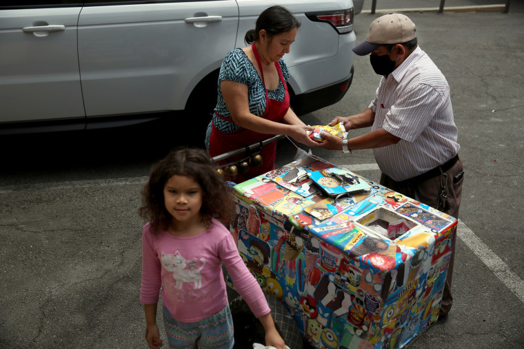 IMage: Mauro Rios Parra sells paletas in Pic Union, near Los Angeles, in 2020. Parra came to the United States from Mexico 20 years ago, and has sold paletas to support his family.
