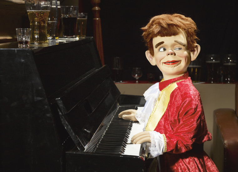 Ventriloquist doll playing piano