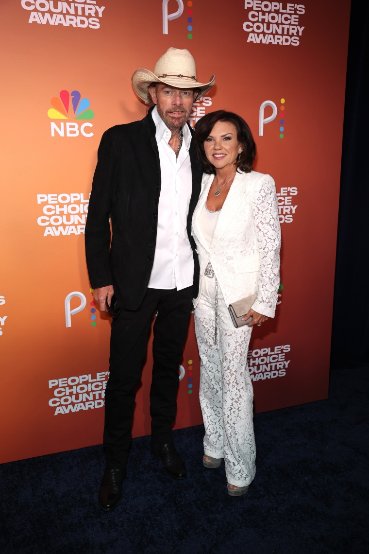 Toby Keith and Tricia Lucus posed together at the 2023 People's Choice Country Awards.