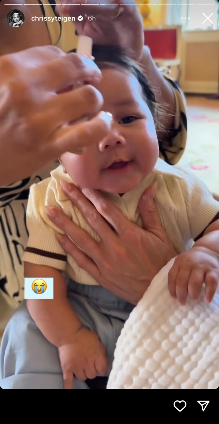 Baby Wren getting his hair styled.